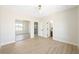 Bedroom with wood-look flooring, mirrored closet, and hallway and bathroom access at 17 Winding Rd, Henderson, NV 89052