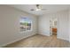 Bedroom featuring a ceiling fan, window, and an ensuite bathroom at 17 Winding Rd, Henderson, NV 89052