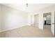 Bedroom with sleek flooring, a mirrored closet, and access to the staircase at 17 Winding Rd, Henderson, NV 89052
