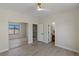 Bright bedroom features a ceiling fan, a mirrored closet and vinyl wood flooring at 17 Winding Rd, Henderson, NV 89052