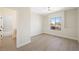 Bright bedroom featuring wood-look floors, a window, and access to the bathroom at 17 Winding Rd, Henderson, NV 89052