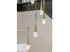 A modern chandelier hangs with teardrop-shaped glass and gold lights at 17 Winding Rd, Henderson, NV 89052