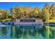 Beautiful Anthem Country Club entrance with stacked stone waterfalls and lush landscaping at 17 Winding Rd, Henderson, NV 89052