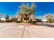 Lushly landscaped community entrance with mature trees and manicured grounds at 17 Winding Rd, Henderson, NV 89052