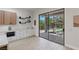 Bright dining space with access to an outdoor patio via sliding glass doors and custom shelving at 17 Winding Rd, Henderson, NV 89052