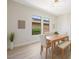 Bright dining room with modern lighting and natural light streaming through the windows at 17 Winding Rd, Henderson, NV 89052