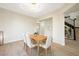 Inviting dining room featuring stylish light fixture and view of the staircase at 17 Winding Rd, Henderson, NV 89052