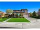 Well-maintained two-story home with mature landscaping and attached garage at 17 Winding Rd, Henderson, NV 89052