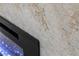 Close up of the fireplace with light marble and black fireplace insert at 17 Winding Rd, Henderson, NV 89052