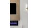 Close-up on a contemporary fireplace with electric flames and wood-textured paneling at 17 Winding Rd, Henderson, NV 89052