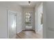 Bright foyer features modern front door and sleek wood floors at 17 Winding Rd, Henderson, NV 89052
