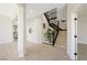 Spacious entryway with a staircase and neutral color palette at 17 Winding Rd, Henderson, NV 89052