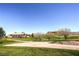 Picturesque golf course with lush greenery, mature trees, and a view of the clubhouse on a sunny day at 17 Winding Rd, Henderson, NV 89052