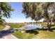 Picturesque golf course with a serene pond, lush greenery, and mature trees creating a tranquil setting at 17 Winding Rd, Henderson, NV 89052
