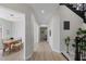 Inviting hallway features modern flooring and leads to dining area with stylish lighting at 17 Winding Rd, Henderson, NV 89052