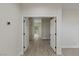 Spacious hallway featuring wood floors and white doors at 17 Winding Rd, Henderson, NV 89052