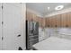 Modern kitchen featuring a stainless steel refrigerator and custom cabinets at 17 Winding Rd, Henderson, NV 89052