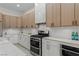 Stylish kitchen showcasing a gas range, custom cabinets, and modern white countertops at 17 Winding Rd, Henderson, NV 89052