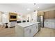 Bright kitchen featuring stainless steel appliances, a large island and pendant lighting at 17 Winding Rd, Henderson, NV 89052