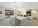 Modern open-plan kitchen features a large island and stainless steel appliances at 17 Winding Rd, Henderson, NV 89052