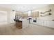 Large kitchen with a breakfast bar, stainless steel appliances, and ample counter space at 17 Winding Rd, Henderson, NV 89052