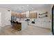 Modern kitchen with island seating, stainless steel appliances, and ample cabinet space at 17 Winding Rd, Henderson, NV 89052