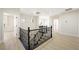 Bright landing with wood floors, iron railing and natural light at 17 Winding Rd, Henderson, NV 89052