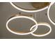 Close-up of a modern, circular, LED light fixture with gold accents at 17 Winding Rd, Henderson, NV 89052