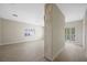 Expansive living room with a fireplace feature, lots of natural light, and light hardwood floors at 17 Winding Rd, Henderson, NV 89052