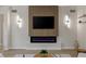 Elegant living room showcases fireplace, sleek lighting, and contemporary design at 17 Winding Rd, Henderson, NV 89052