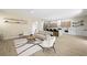 Open concept living space with hardwood floors, modern decor, and natural light at 17 Winding Rd, Henderson, NV 89052