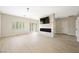Bright living room with fireplace feature wall, modern lighting, and sliding glass doors at 17 Winding Rd, Henderson, NV 89052
