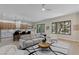 Open concept living space featuring kitchen, seating, and access to the outdoors at 17 Winding Rd, Henderson, NV 89052