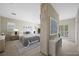 Bright main bedroom featuring a king bed, ceiling fan, neutral paint and light floors at 17 Winding Rd, Henderson, NV 89052