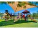 Colorful playground featuring multiple slides, climbing structures, and a shaded area for fun and safety at 17 Winding Rd, Henderson, NV 89052