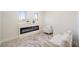 Sitting room features a modern electric fireplace and neutral decor at 17 Winding Rd, Henderson, NV 89052