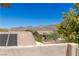 View of the mountains and rooftops from the patio at 17 Winding Rd, Henderson, NV 89052