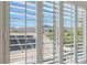 View of the mountain range from a window with white shutters at 17 Winding Rd, Henderson, NV 89052