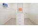 Spacious walk-in closet featuring white shelving and drawers, designed for optimal storage and organization at 17 Winding Rd, Henderson, NV 89052