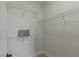Walk-in closet features wire shelving and base molding at 17 Winding Rd, Henderson, NV 89052