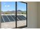 View from the window looking out at mountains and neighborhood rooftops at 17 Winding Rd, Henderson, NV 89052