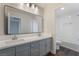 Clean bathroom with double vanity and a separate bathtub at 2257 Loring Ave, Henderson, NV 89074