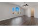 Spacious bedroom featuring hardwood floors and a large arched window at 2257 Loring Ave, Henderson, NV 89074