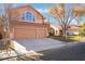 Two-story house with three-car garage, landscaping, and a large front yard at 2257 Loring Ave, Henderson, NV 89074