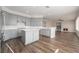 Spacious kitchen with island, stainless steel appliances, and gray cabinets at 2257 Loring Ave, Henderson, NV 89074