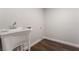 Laundry room with utility sink and vinyl flooring at 2257 Loring Ave, Henderson, NV 89074