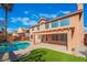 Home exterior showcasing a kidney-shaped pool and spacious patio at 2257 Loring Ave, Henderson, NV 89074