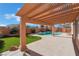 Inviting kidney-shaped pool with a pergola-covered patio at 2257 Loring Ave, Henderson, NV 89074