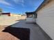 Large backyard with covered patio and ample concrete space at 132 W Victory Rd, Henderson, NV 89015