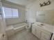 Clean bathroom with tub, toilet and vanity at 132 W Victory Rd, Henderson, NV 89015